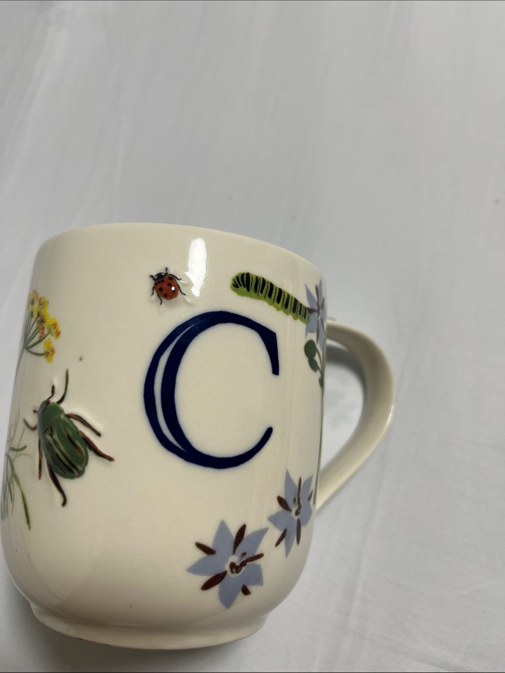 Anthropologie Cream Mug with Navy 'C' and Botanical Insects